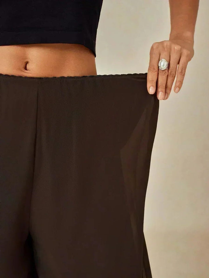 Women's elegant wide leg overlay pants, perfect for upscale evening wear and special occasions.