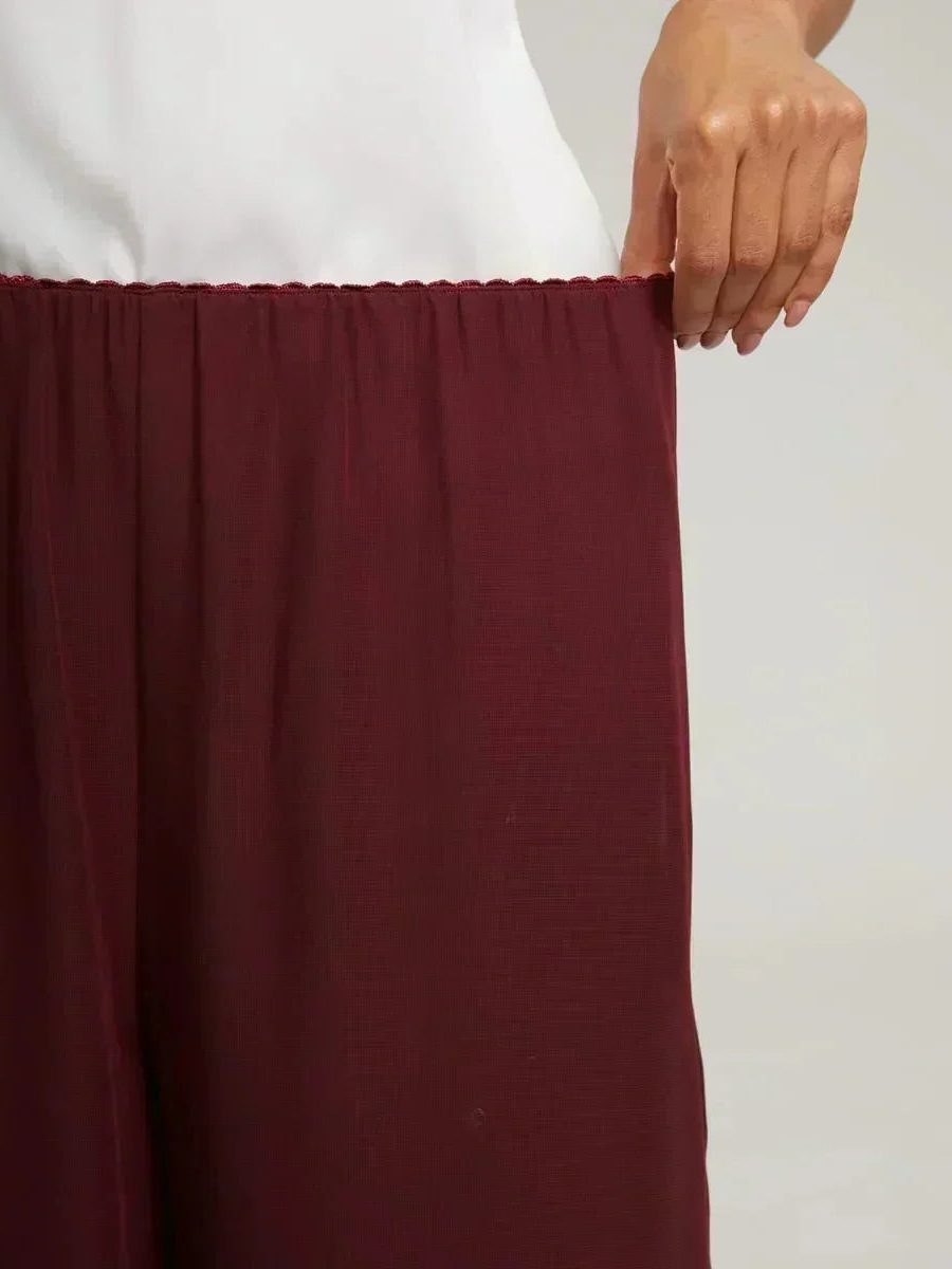 Comfortable and elegant women's wide leg pants with a chic overlay and flattering tie-waist.