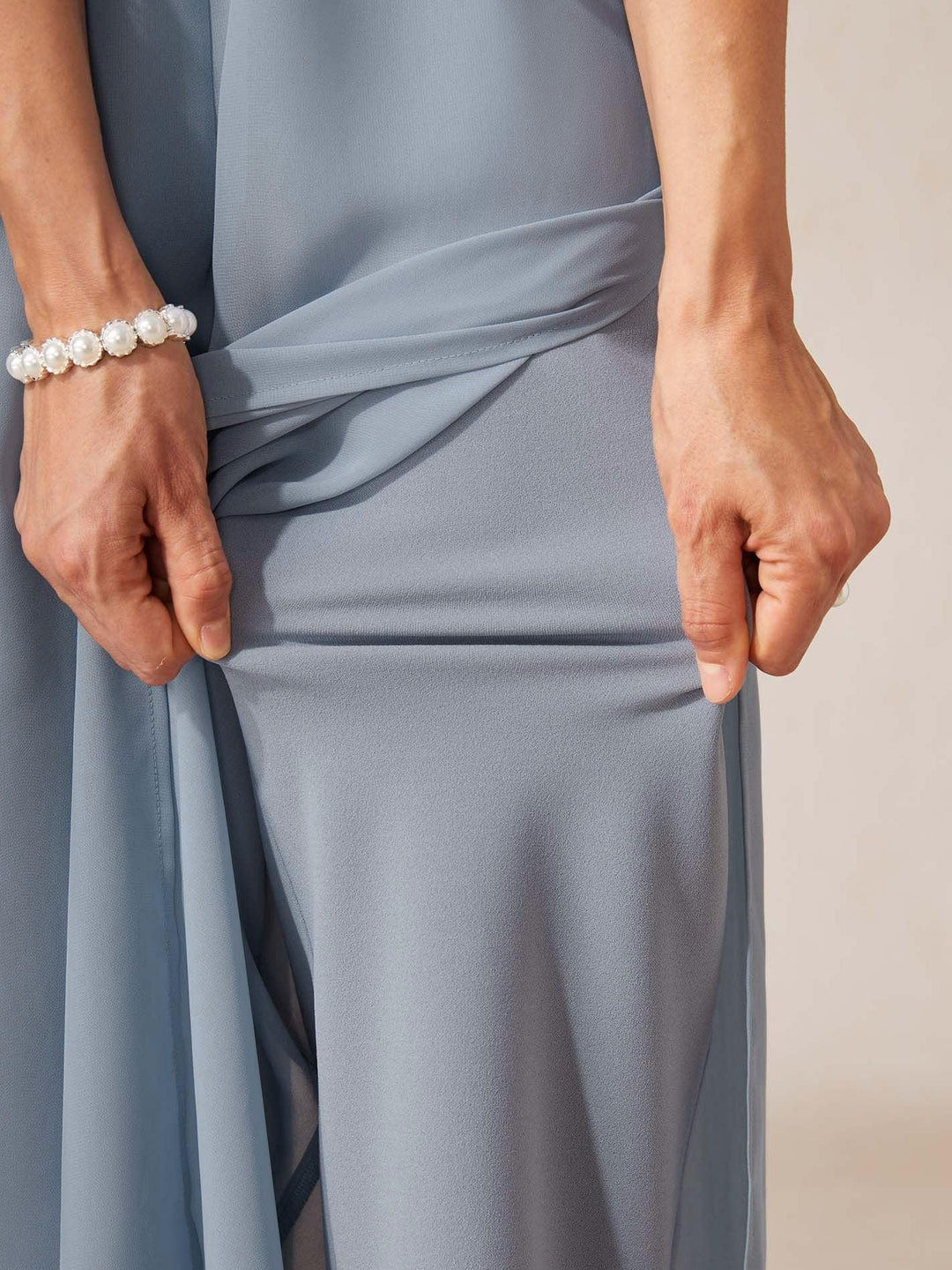 Stylish women's wide leg pants with an elegant overlay and tie waist, great for evening or casual.