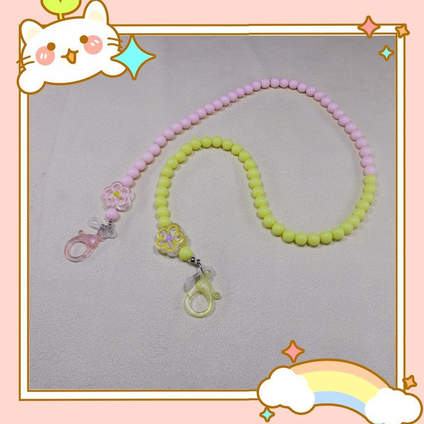 Elegant women's pearl & bead eyeglass chain, stylish eyewear holder with white pearls and colorful beads.