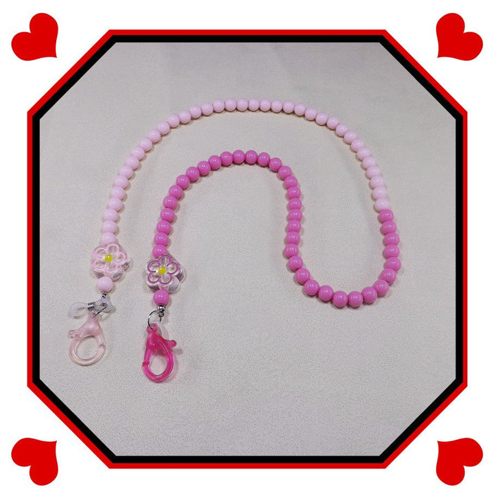 Vibrant beaded and pearl glasses chain, an elegant and secure women's eyewear holder accessory.