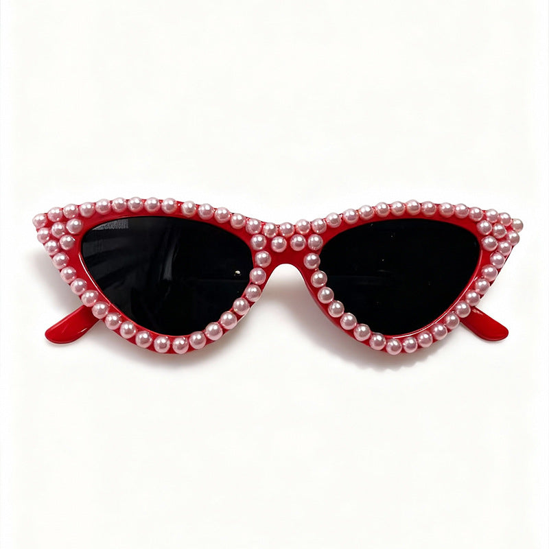 Fashionable women's eyewear: pearl-accented cat eye sunglasses with full UV blocking lenses.