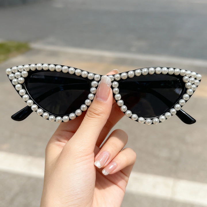 Sophisticated women's pearl cat eye sunglasses, ideal for elevating any outfit with UV defense.