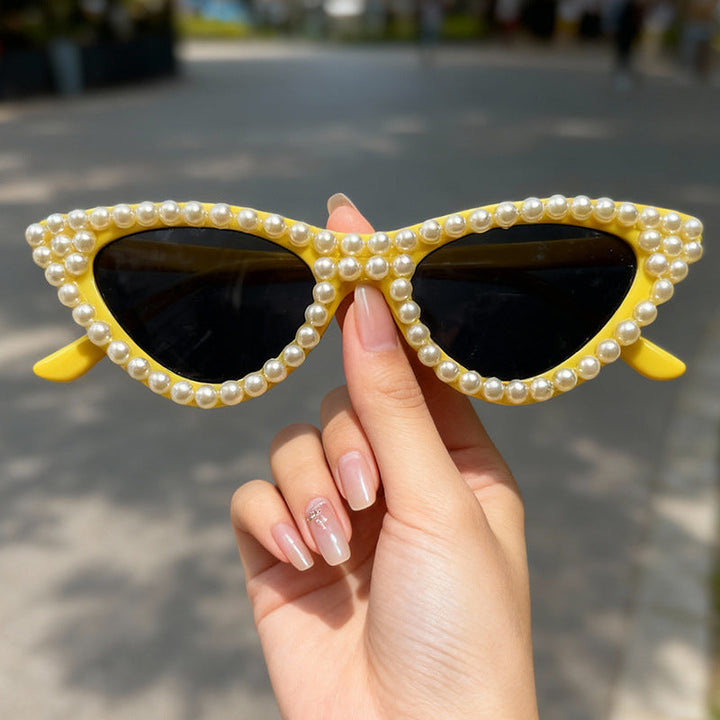 Glamorous women's pearl cat eye sunglasses, combining chic style with effective UV protection.