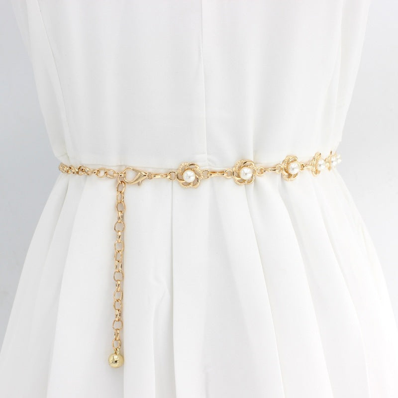 Elegant women's pearl chain belt with gold accents, perfect for dresses & formal wear. Adjustable fashion accessory.