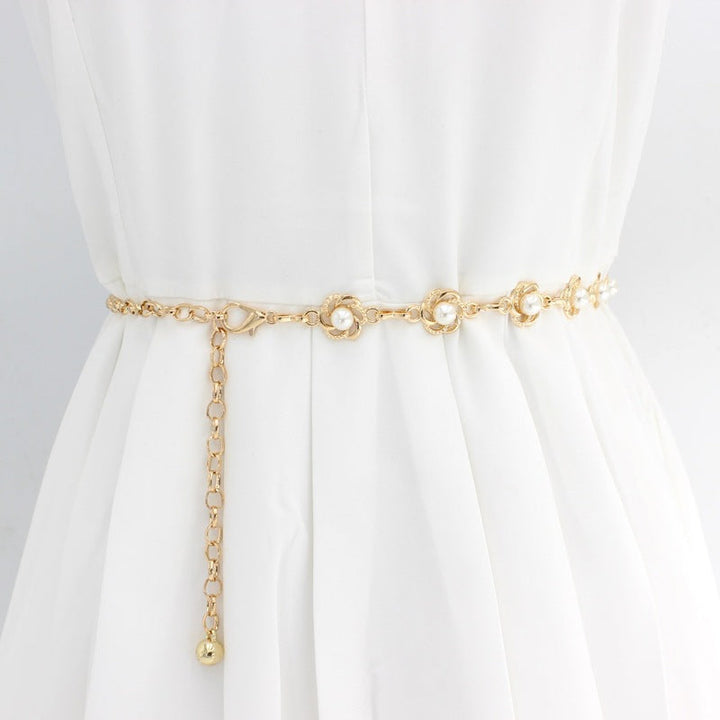 Elegant women's pearl chain belt with gold accents, perfect for dresses & formal wear. Adjustable fashion accessory.
