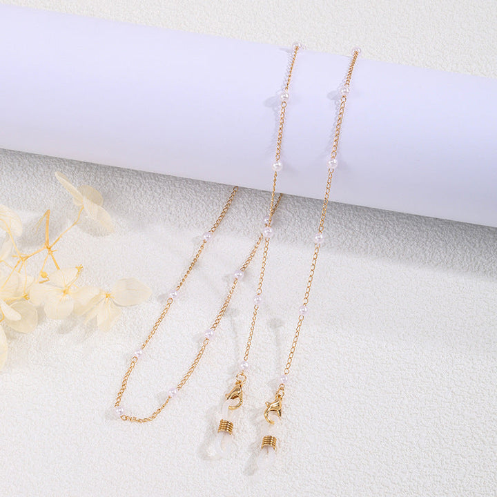 Elegant women's pearl chain necklace in classic white & luxurious gold, a delicate fashion accessory, perfect pearl jewelry.