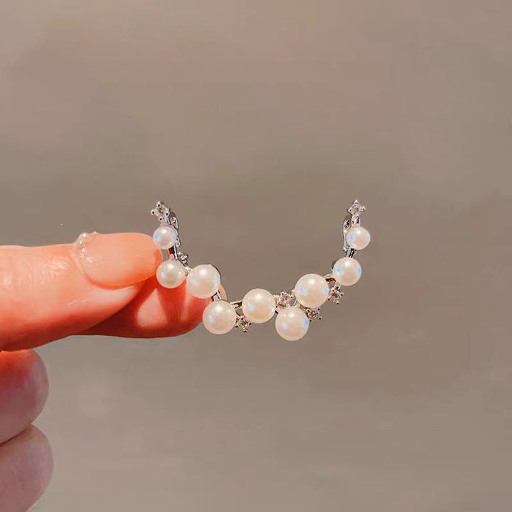 Fashionable elegant pearl drop earrings for women, versatile timeless jewelry for everyday wear or evening.