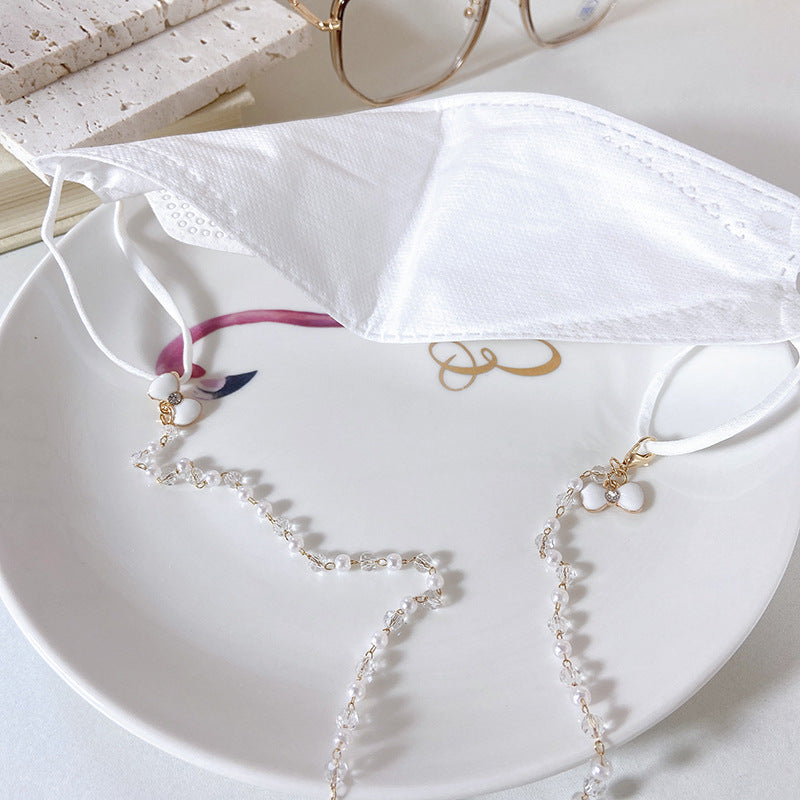 Sophisticated pearl flower drop earrings for women. Statement wedding jewelry, ideal for elegant occasions.