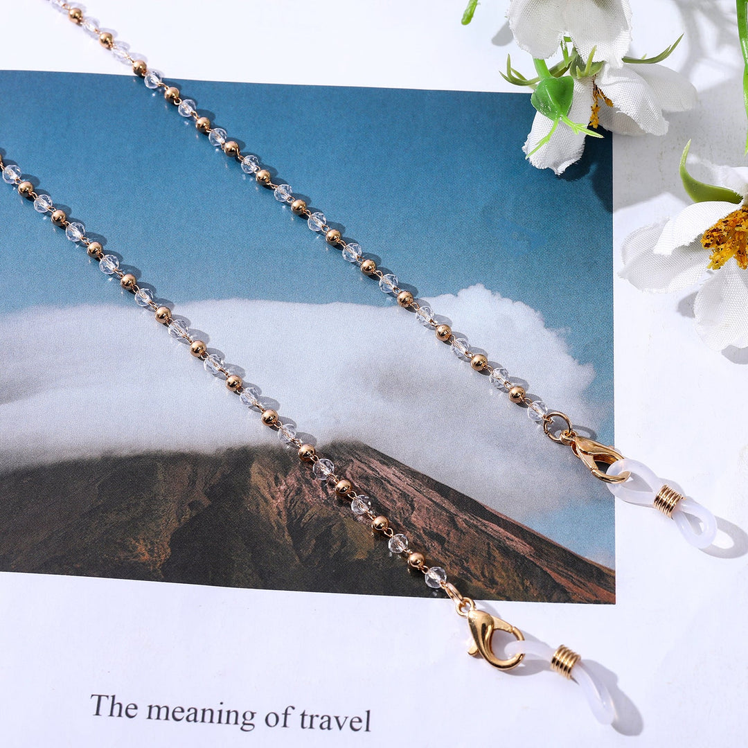 Delicate gold chain necklace adorned with pearls, an elegant women's jewelry piece perfect for any occasion.