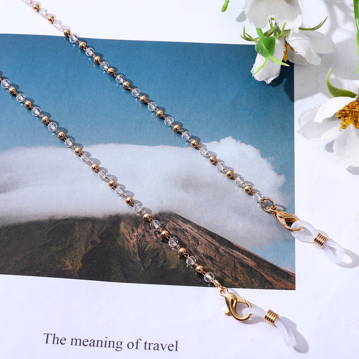 Delicate gold chain necklace adorned with pearls, an elegant women's jewelry piece perfect for any occasion.