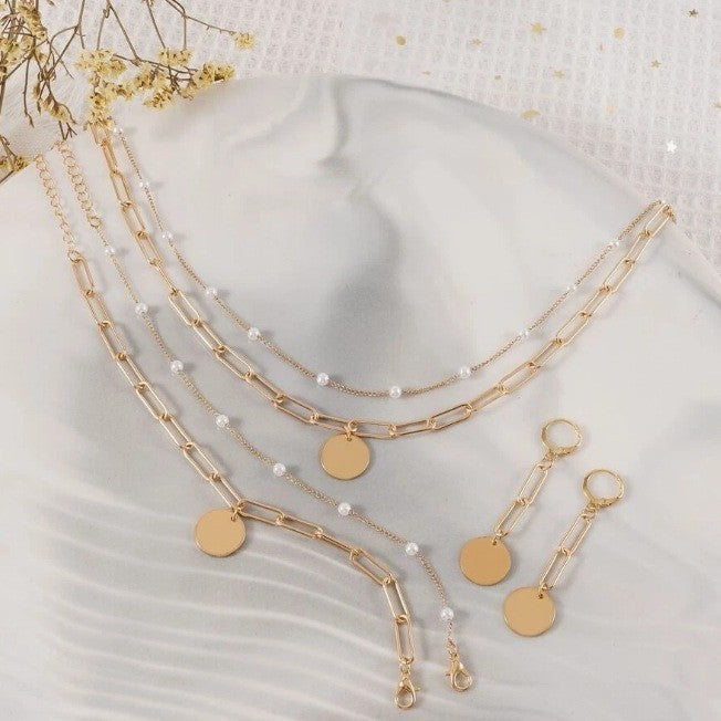 Stylish women's pearl & gold chain bracelet and matching earrings, an elegant accessory or gift for her.