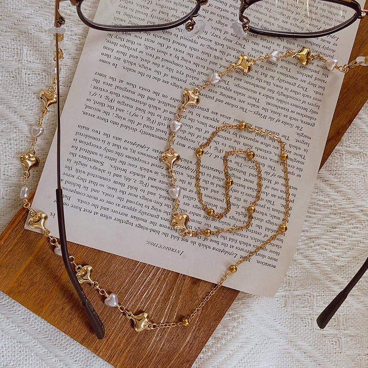 Elegant women's pearl necklace with gold accents, perfect for special occasions & everyday chic.