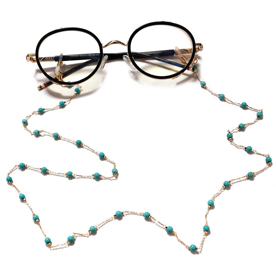 Close-up of an elegant pearl filigree pendant necklace, a delicate piece of women's fashion jewelry.