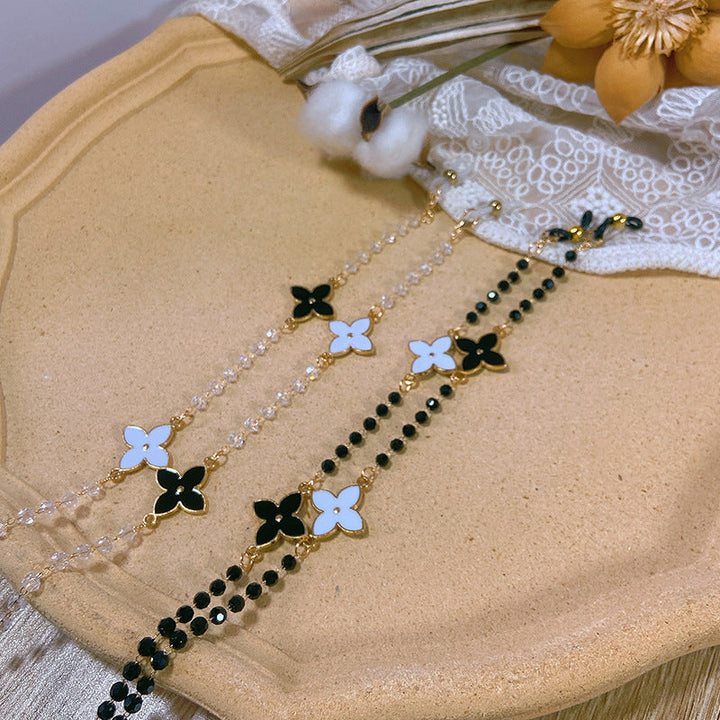 Stylish women's fashion necklace, a statement piece with luminous pearls and artisan-crafted flower details.