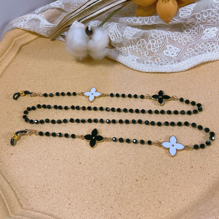 Handcrafted elegant pearl necklace with multiple floral pendants, a perfect women's gift for special occasions.