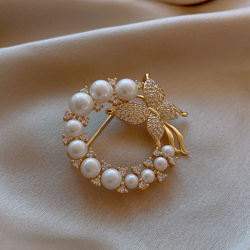 Versatile women's elegant pearl & rhinestone butterfly brooch, a stunning jewelry accessory or gift pin.