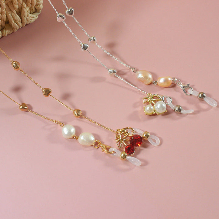 Elegant women's pearl ribbon necklace with shimmering silver accents, perfect for special occasions or glamorous everyday wear.