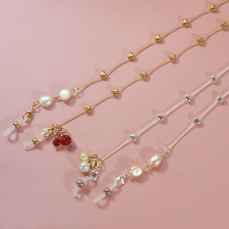 Fashionable pearl ribbon choker for women, featuring exquisite gold accents, an elegant neck accessory for any occasion.