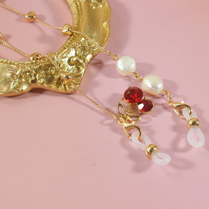 Glamorous pearl ribbon jewelry with silver & gold accents, a versatile women's neck accessory for elegant style.