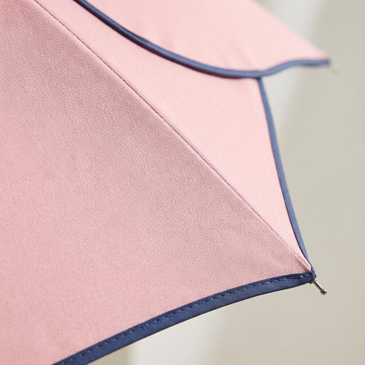 Fashionable women's UV protection umbrella, featuring a distinct petal shape & comfortable wooden handle.