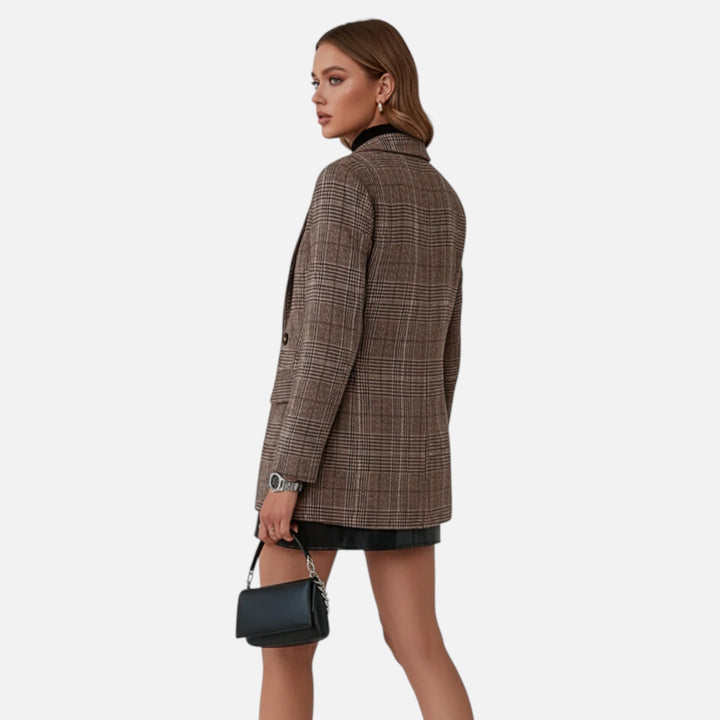 Professional women's plaid blazer, designed with lapels for a polished office look. Essential women's clothing.
