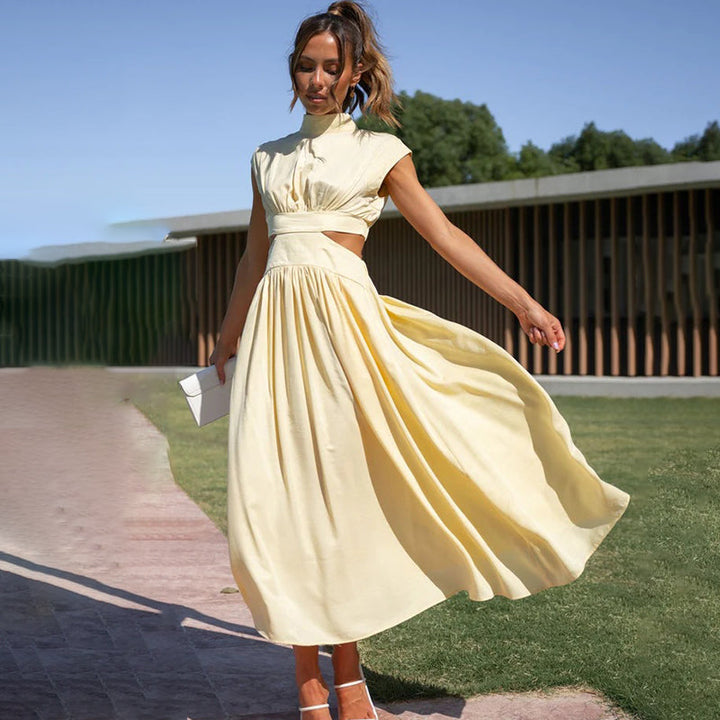 Stylish occasion midi dress for women. Features cap sleeves & elegant pleats, perfect for any event.