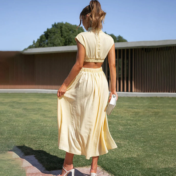 Effortless pull-on women's midi dress. Solid color, cap sleeves, and flattering pleats for daily wear.