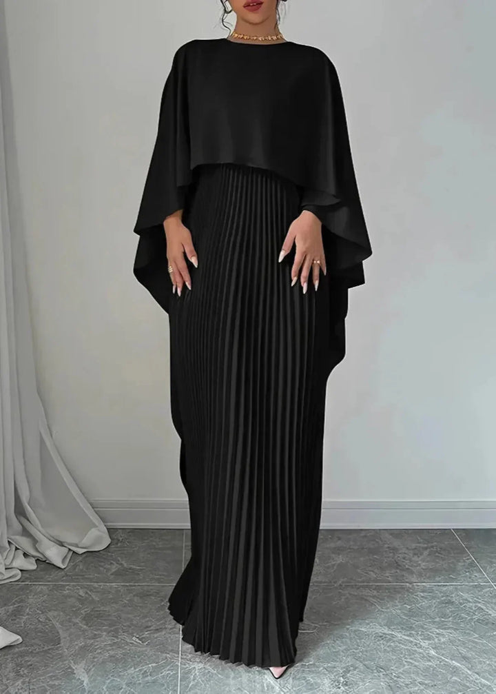 Beautiful women's pleated maxi dress with a stylish cape, an elegant choice for any wedding or formal event.