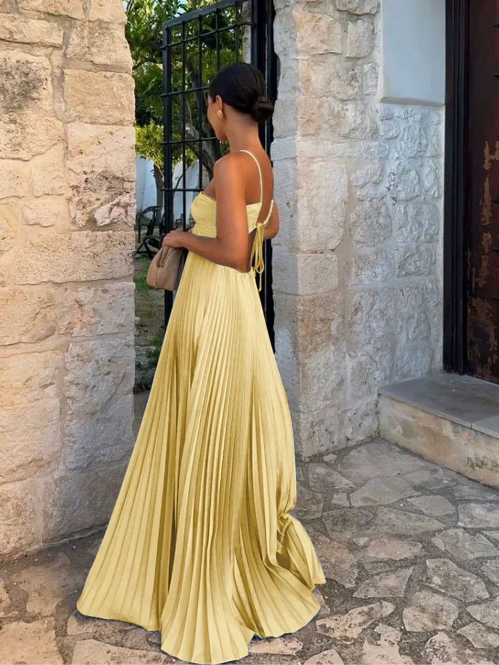 Chic women's halter neck maxi dress, pleated design & side cut-outs for elegant party wear & special occasions.