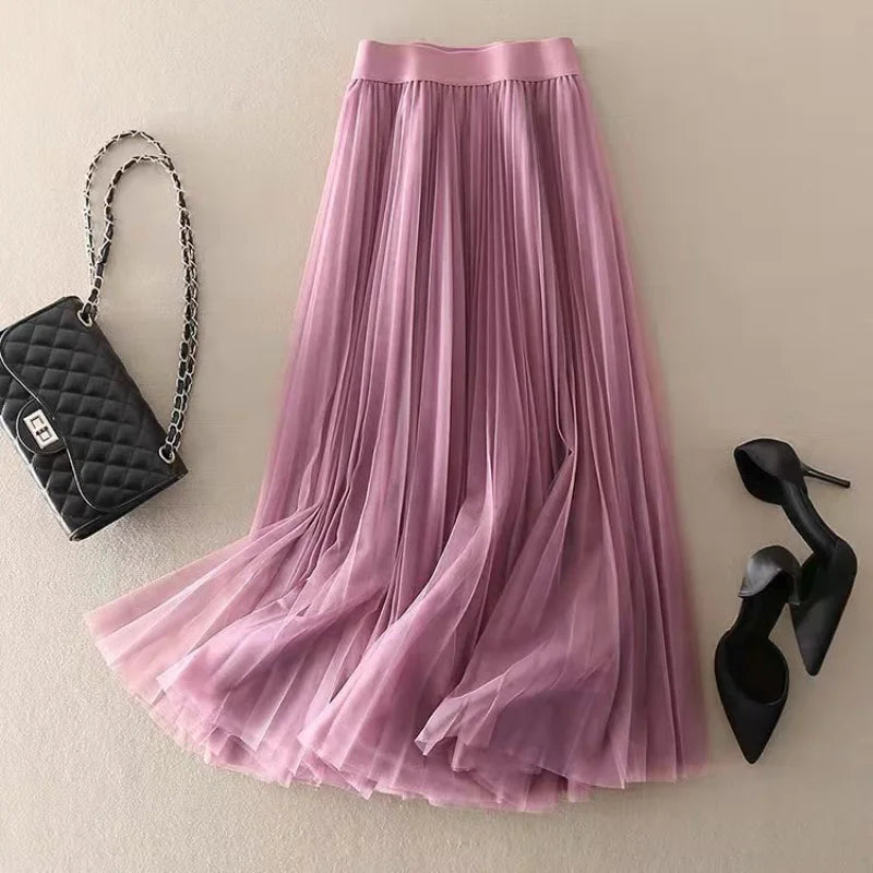 Stylish blue high-waisted A-line midi skirt with pleats, suitable for women's smart casual outfits.
