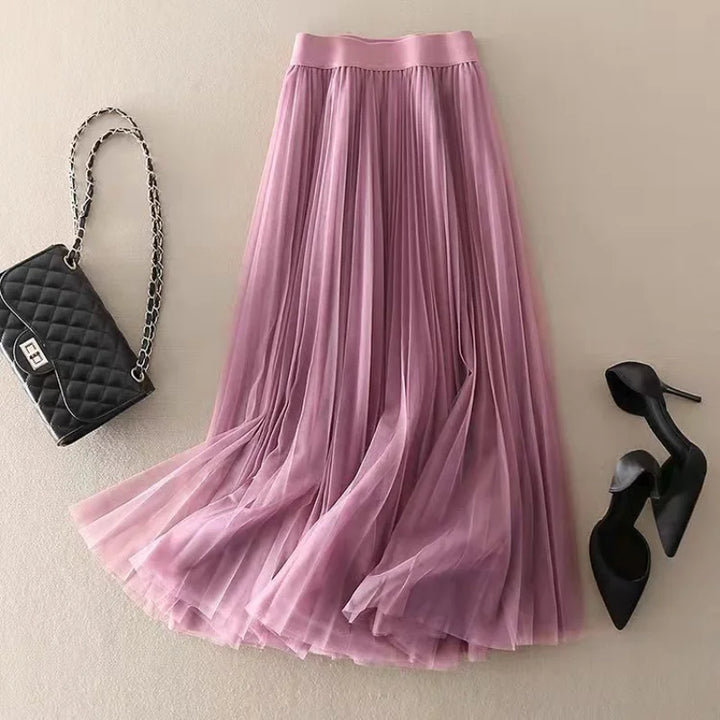 Stylish blue high-waisted A-line midi skirt with pleats, suitable for women's smart casual outfits.