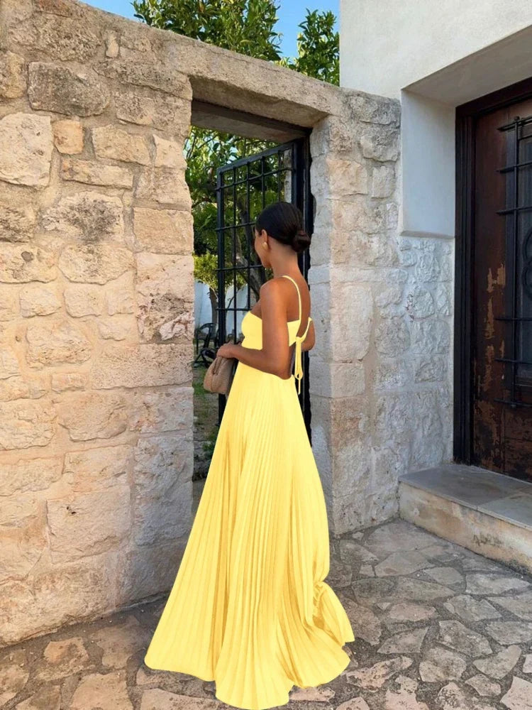 Stylish women's pleated maxi dress, an elegant choice for occasion wear, offering a flattering and comfortable fit.