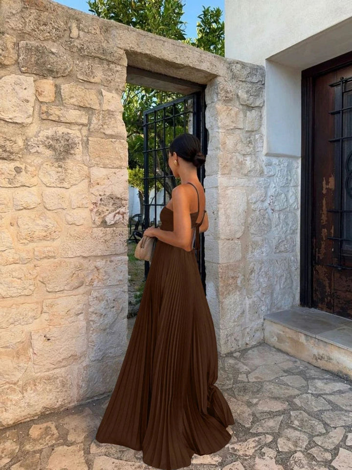 Women's elegant long pleated maxi dress, designed for effortless style and comfort, perfect for various occasions.