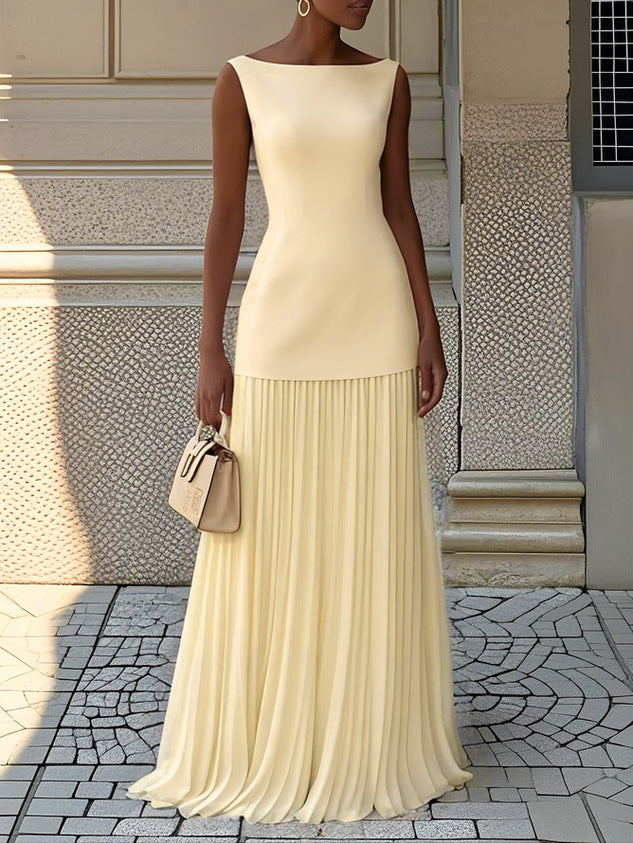 Close-up of a women's elegant pleated maxi dress, showcasing the intricate pleats & flowing fabric for a formal event.