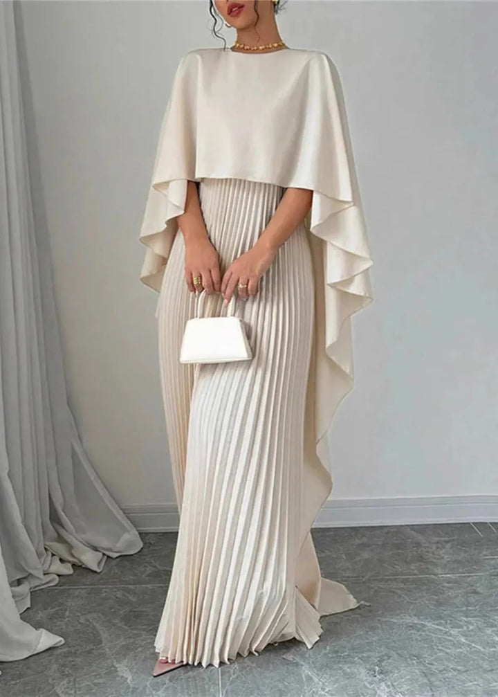 Elegant women's pleated maxi dress with a sophisticated flowing cape overlay, perfect for formal evening wear.