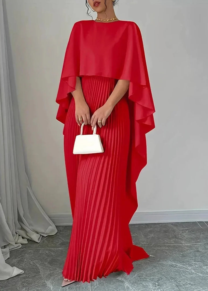 Chic women's long pleated maxi dress featuring a beautiful flowing cape overlay, ideal for elegant evening wear.