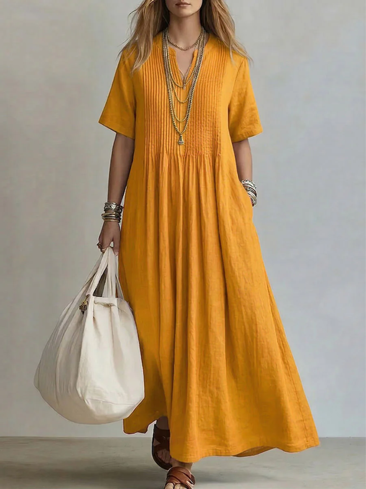 Comfortable women's elegant pleated maxi dress with V-neck and pockets, great for holidays.