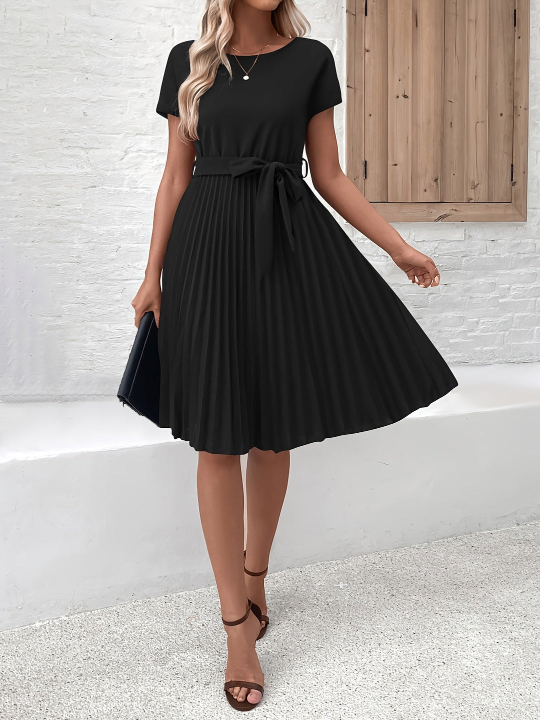 Flowing pleated midi dress with a tie-waist for women, essential for spring & summer style.