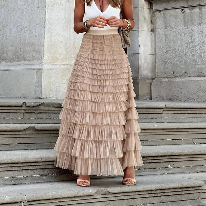 Elegant women's pleated midi skirt, flowy & versatile for chic everyday or special occasion fashion.