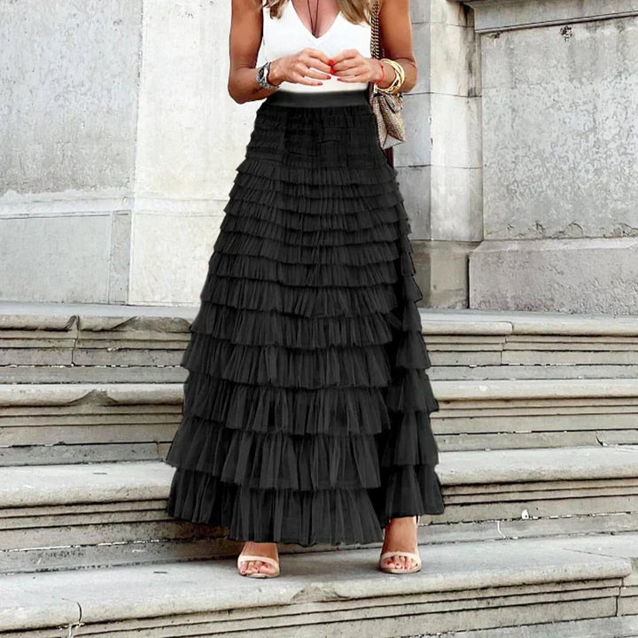 Soft, flowy women's pleated midi skirt, elegant and versatile for comfortable everyday fashion.