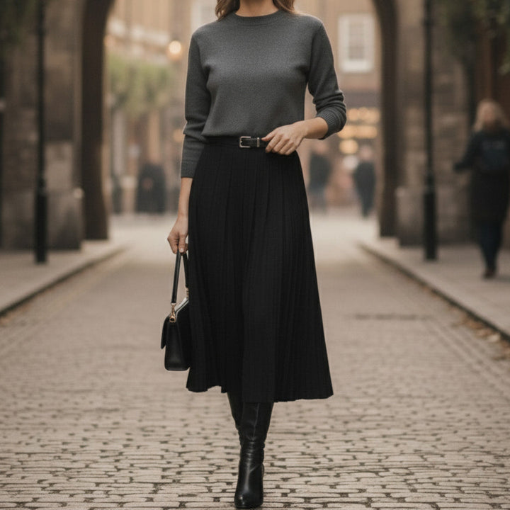 Beautiful women's A-line pleated midi skirt. Its elegant design makes it a versatile wardrobe staple.