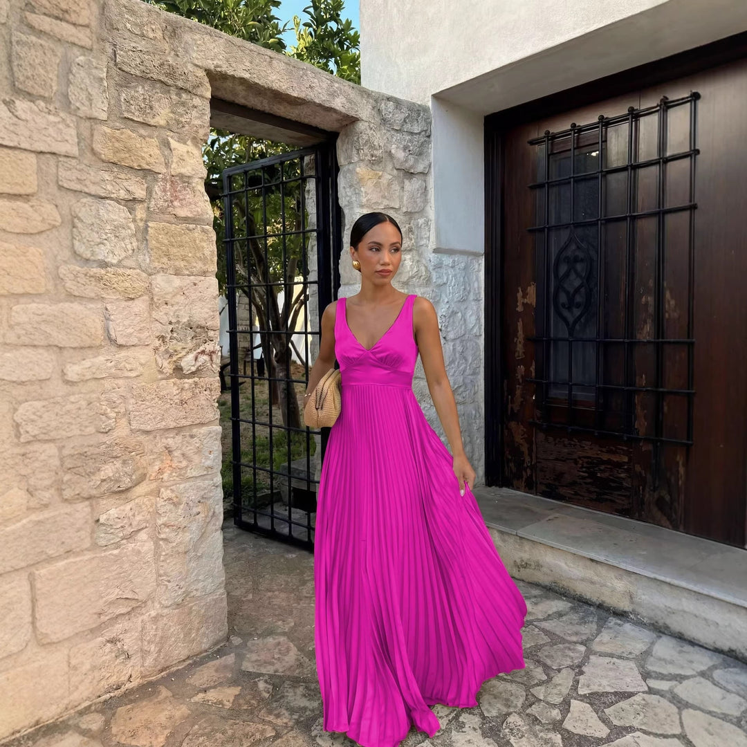 Chic sleeveless V-neck maxi dress with delicate pleats, ideal as a wedding guest or evening gown.
