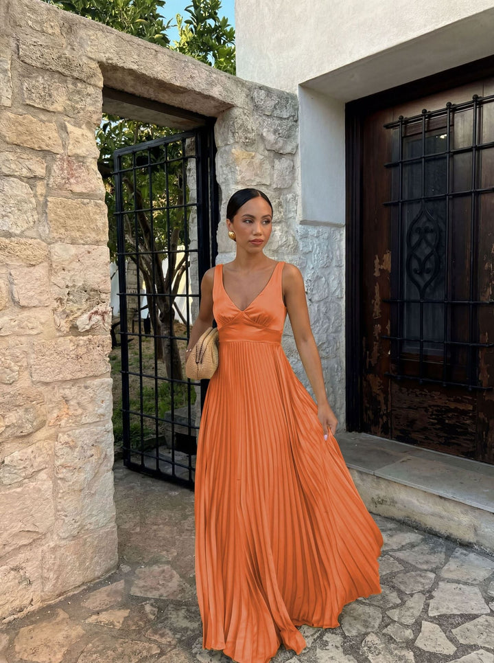 Women's elegant V-neck pleated maxi dress for evening wear, party, or wedding guest attire.
