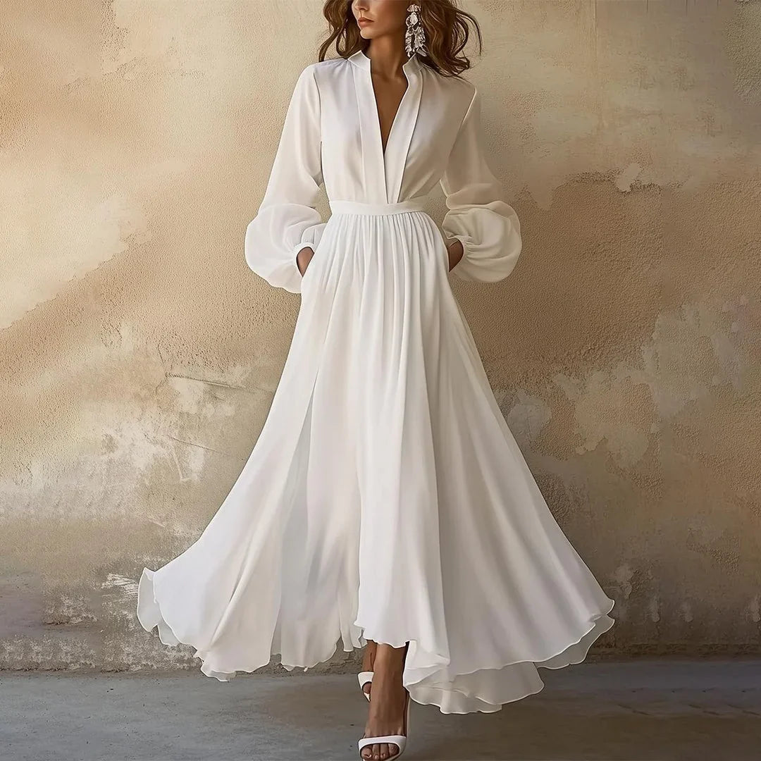 Elegant women's pleated V-neck maxi dress with long balloon sleeves, flowing and versatile for day or evening wear.