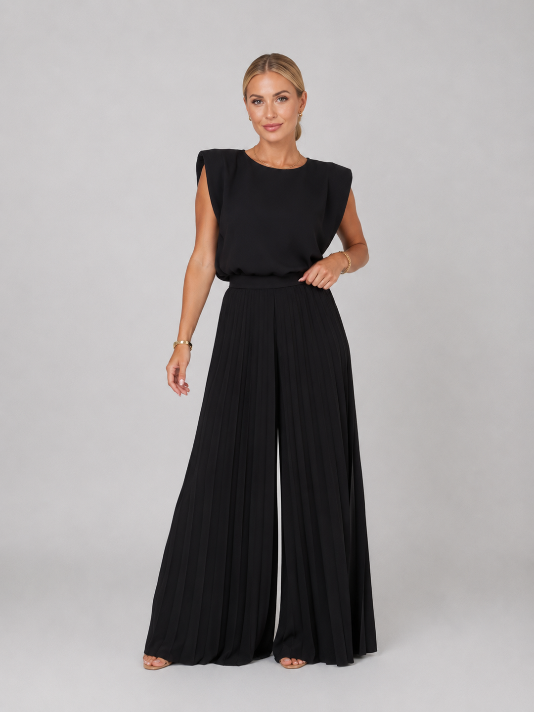 Women's elegant pleated wide-leg trousers and top matching set, ideal for smart casual wear.