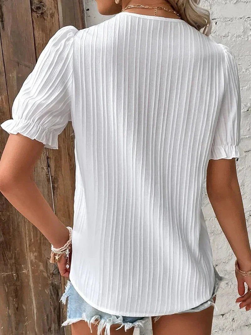 Flowy plus size short sleeve blouse for women, featuring a stylish lace v-neck. Ideal comfortable summer top.