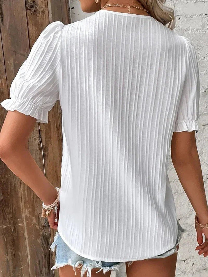 Flowy plus size short sleeve blouse for women, featuring a stylish lace v-neck. Ideal comfortable summer top.