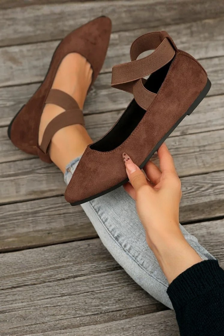 Chic women's pointed toe ballet flats, featuring a comfortable design and elegant ankle strap detail.