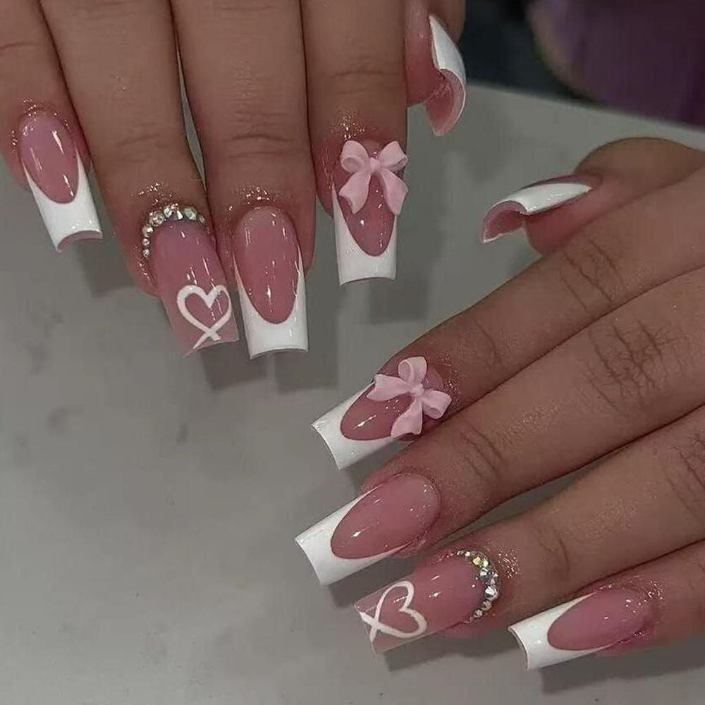 Get an instant elegant manicure with these durable black tip press-on nails adorned with bows & hearts.